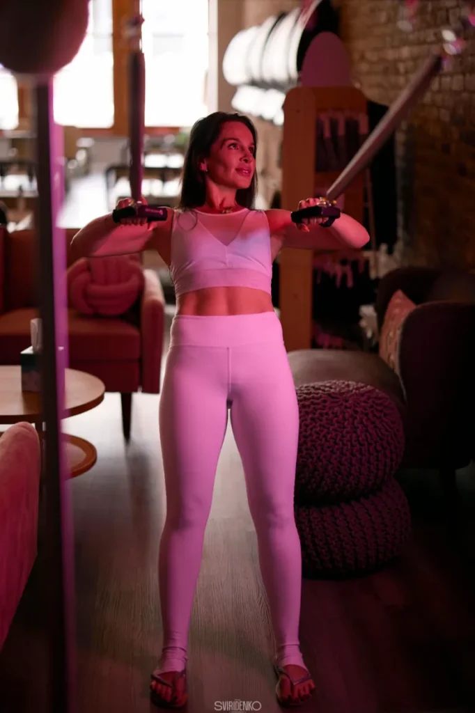Athlete lifting weights in the evening with a thorough warm-up