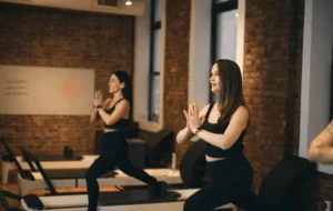Women practicing Pilates vs Yoga at BK Pilates, enjoying movement and focus in a morning class