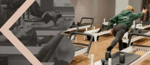 A woman in a Pilates class stretching her back on a reformer