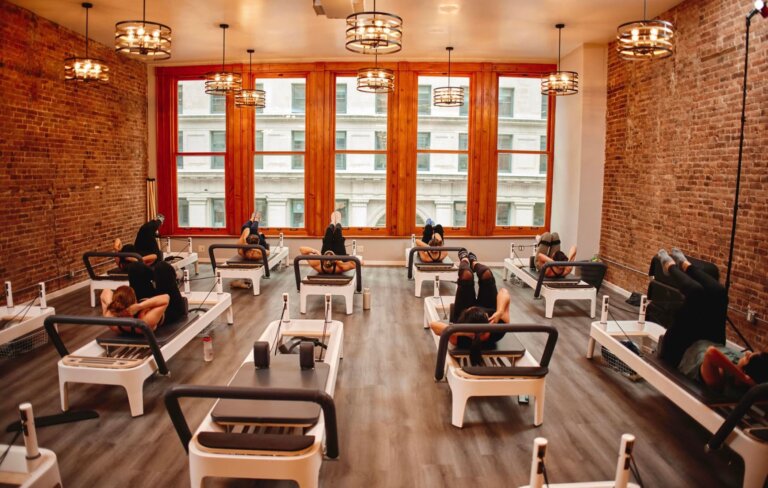 Full reformer Pilates studio at BK Pilates, showing the equipment used to compare mat vs reformer Pilates